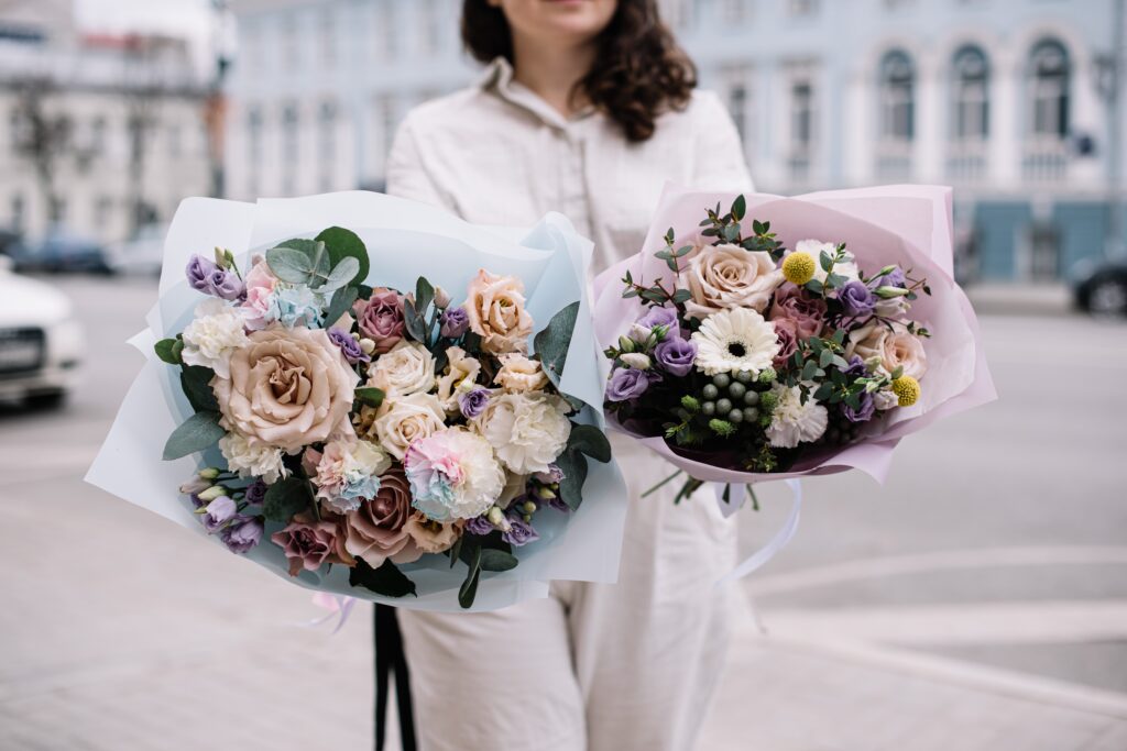 Very,Nice,Young,Woman,Holding,Two,Big,And,Beautiful,Bouquets