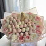 Elegant Champagne & Berries Arrangement—premium bubbly paired with hand-dipped strawberries. Perfect for celebrations & gifting.